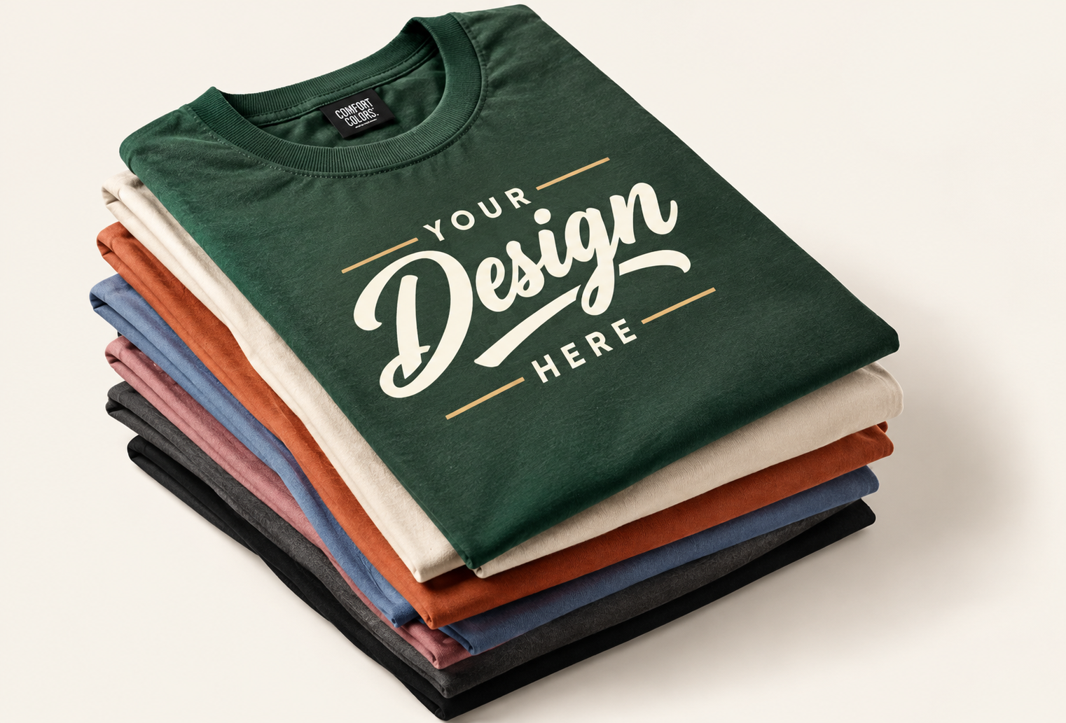 A stack of colorful custom T-shirts with Your Design and Here lettering